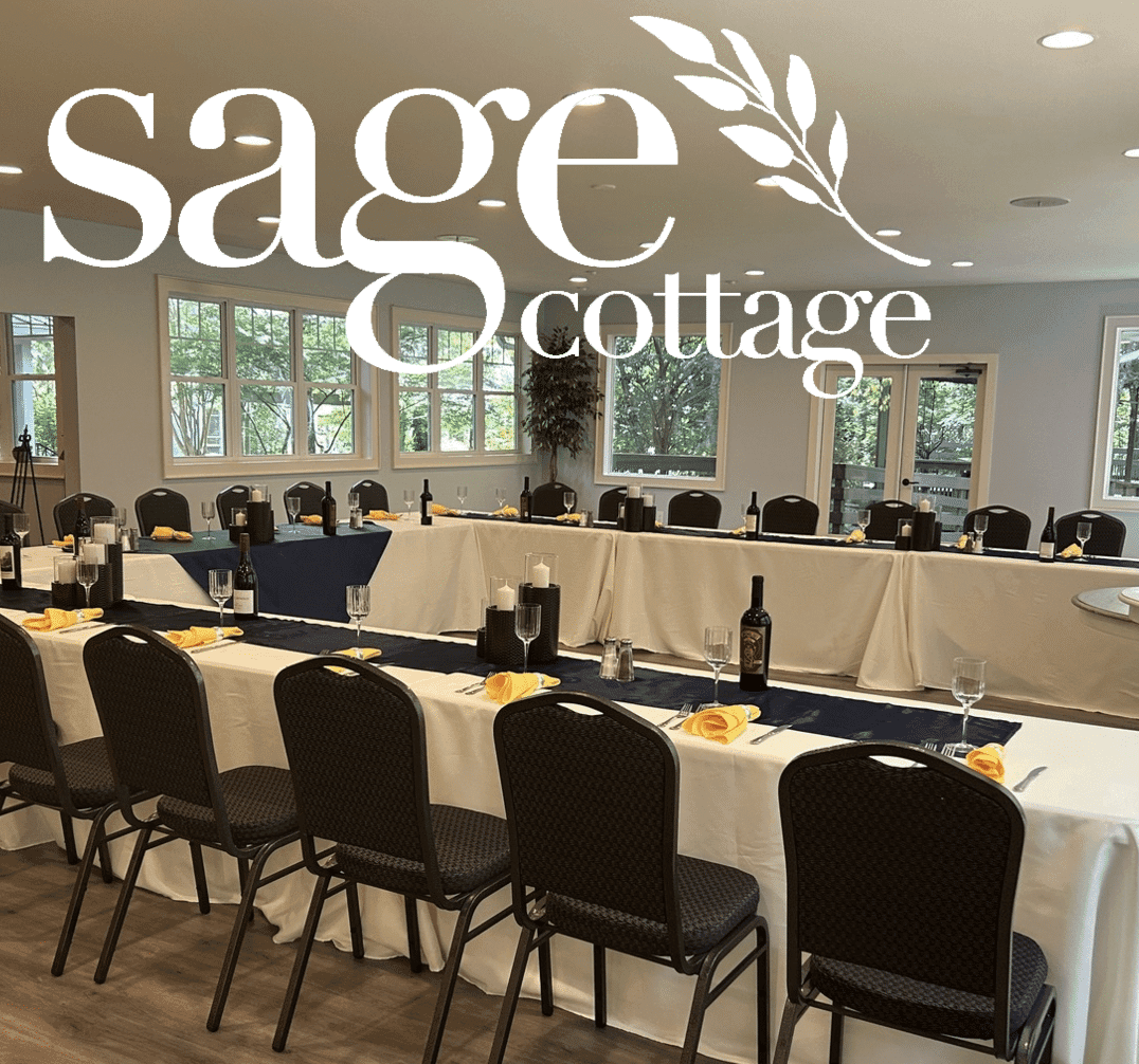 A neatly arranged dining room at Sage Cottage, featuring tables set with yellow napkins and wine bottles. A neatly arranged dining room at Sage Cottage, featuring tables set with yellow napkins and wine bottles.
